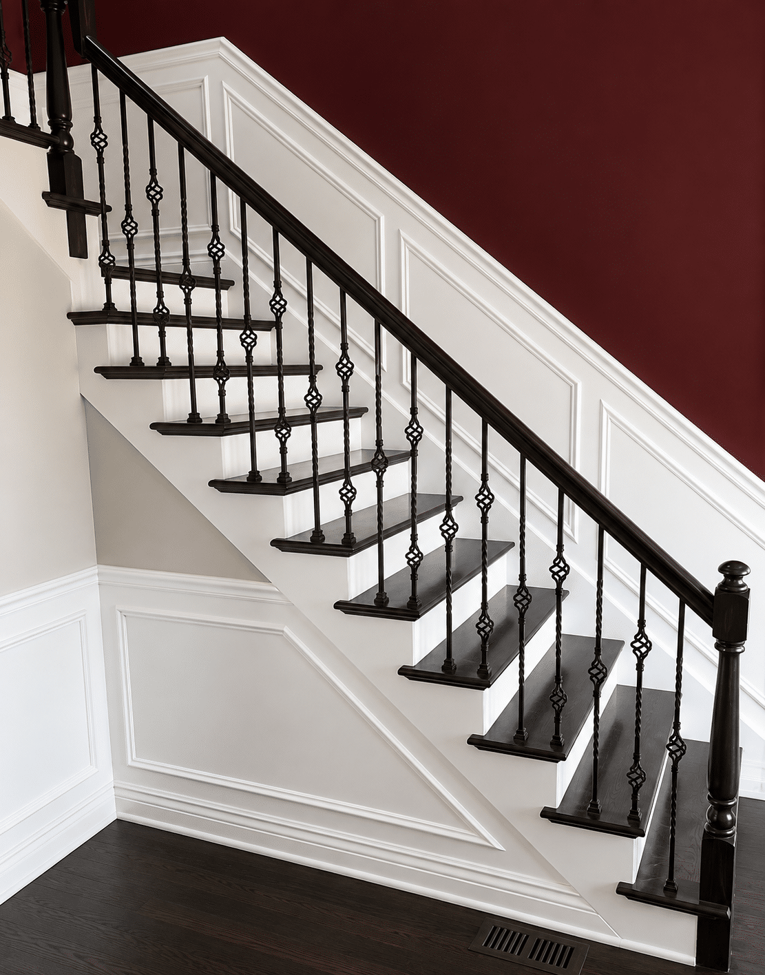 Interior staircase with painted white trim and dark wood details in a Chicago home