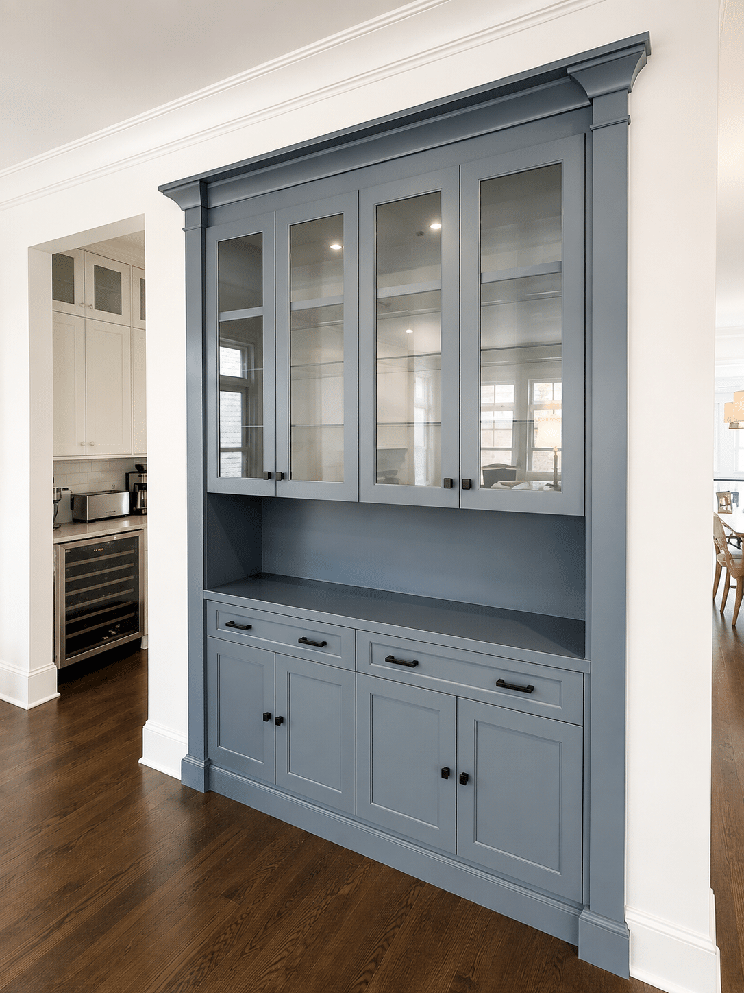 Refinished blue-gray built-in cabinetry with glass doors in a Chicago home