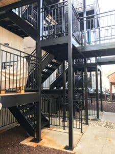 Black winding staircases with fencing