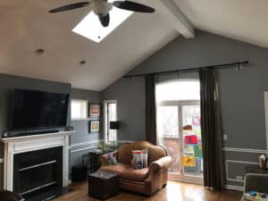 A gray wall living room with a sunroof