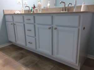 Light blue sink cabinets in a bathroom