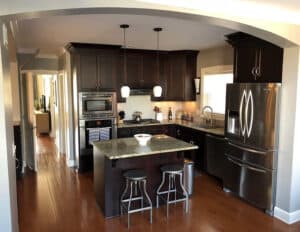 Kitchen with island and dark oak brown cabinets
