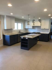 Kitchen with island and white cabinets