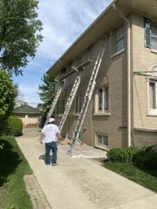 3 ladders on side of house