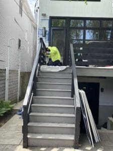 Man painting railing