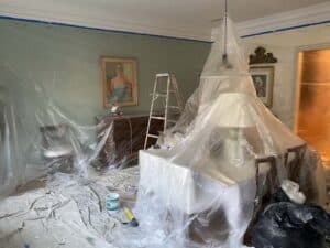 Room covered in plastic for painting