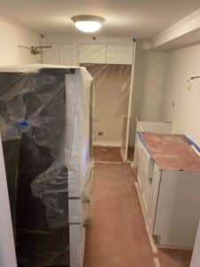 Unfinished kitchen covered in plastic
