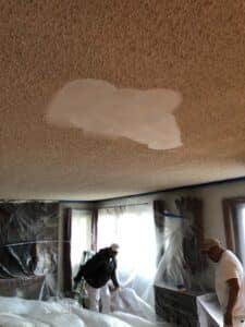 Men working on unfinished ceiling