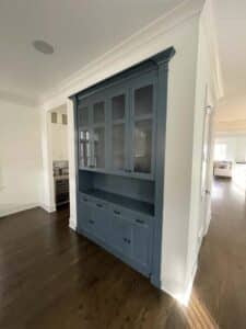 Angled shot of blue grey kitchen cabinet